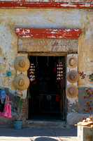 Rustic Mexican Shop Entrance With Traditional Hats