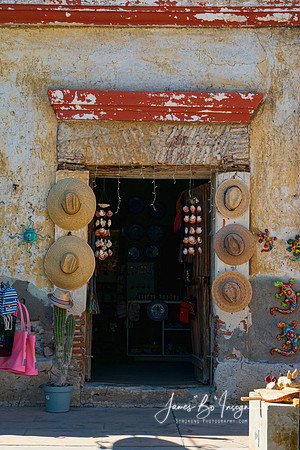 Rustic Mexican Shop Entrance With Traditional Hats