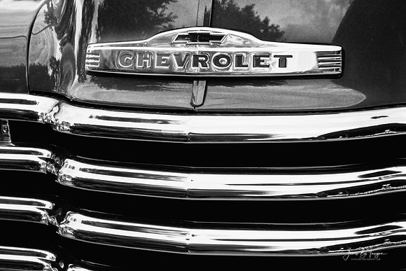 Front of an old vintage Chevrolet truck not sure of the year.  Black and white vintage fine art by James Insogna (C) all rights reserved. 303-834-2524