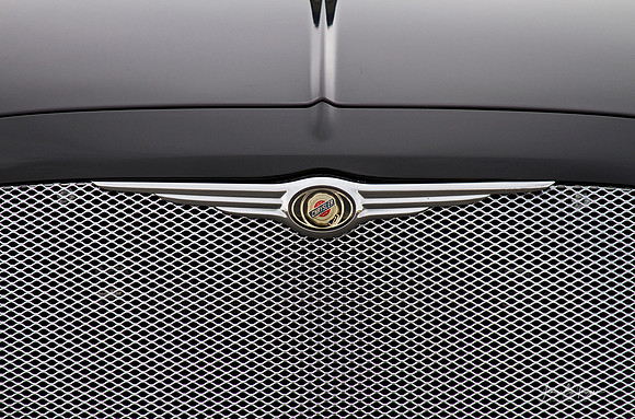 Close-up of a Chrysler 300 Logo and Grill.