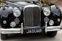 Front End of a Classic Old Black Jaguar