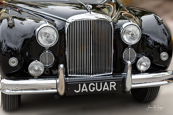 Front End of a Classic Old Black Jaguar