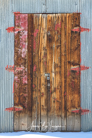 Old_Wood_Door_Six_Red_Hinges
